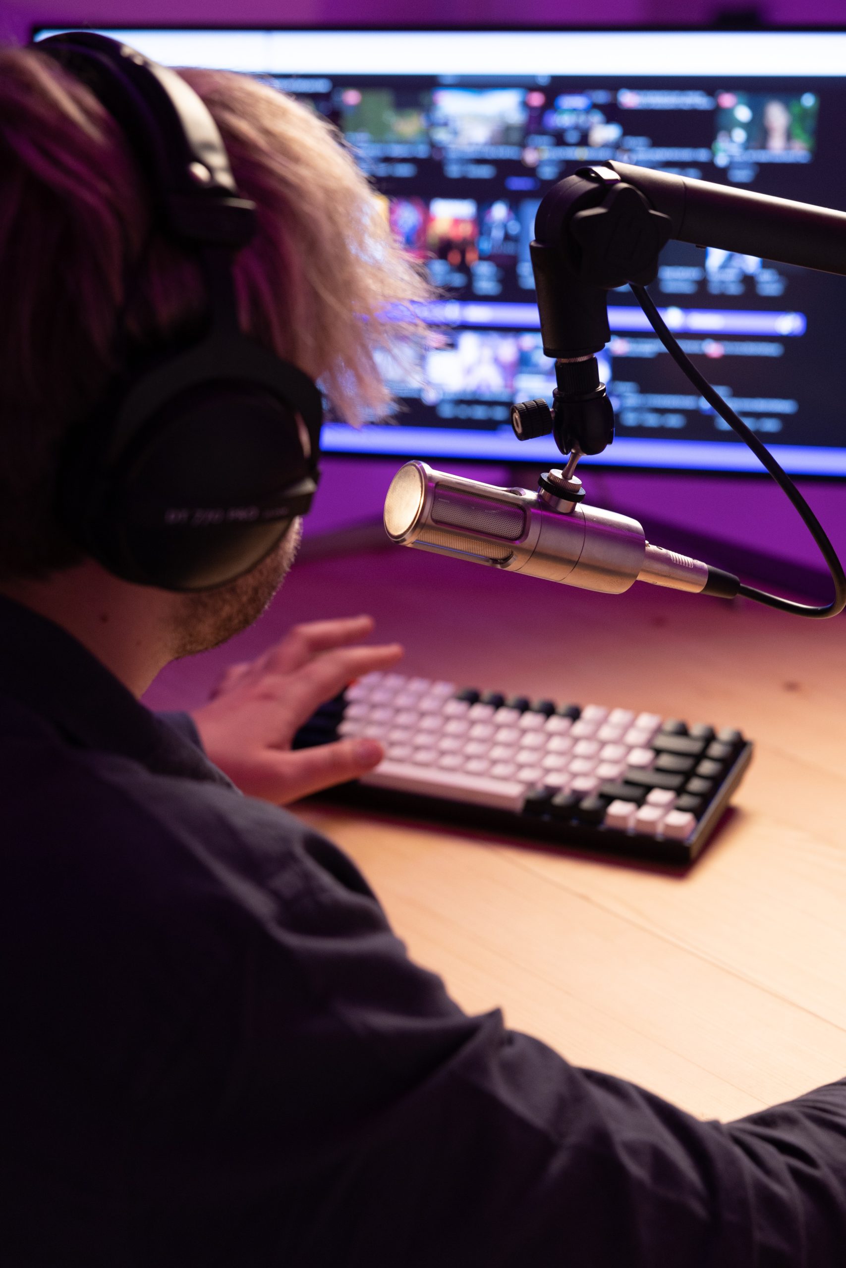 Content creator streaming at a keyboard